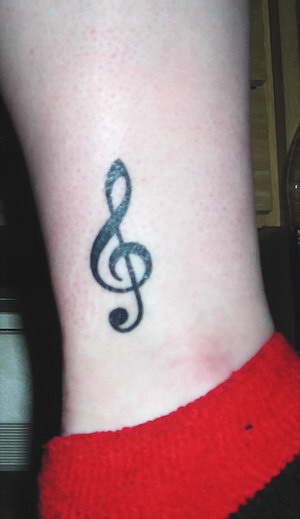 Black Ink Violin Key Music Tattoo On Leg