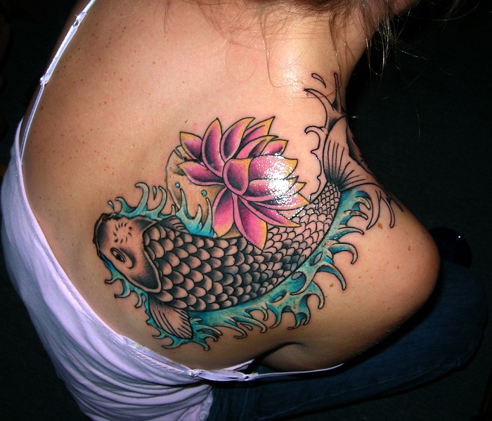 Black Koi Fish With Pink Lotus Tattoo On Girl Right Back Shoulder