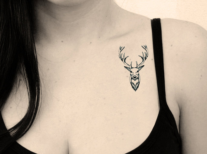 Black Little Deer Head Tattoo On Girl Left Front Shoulder