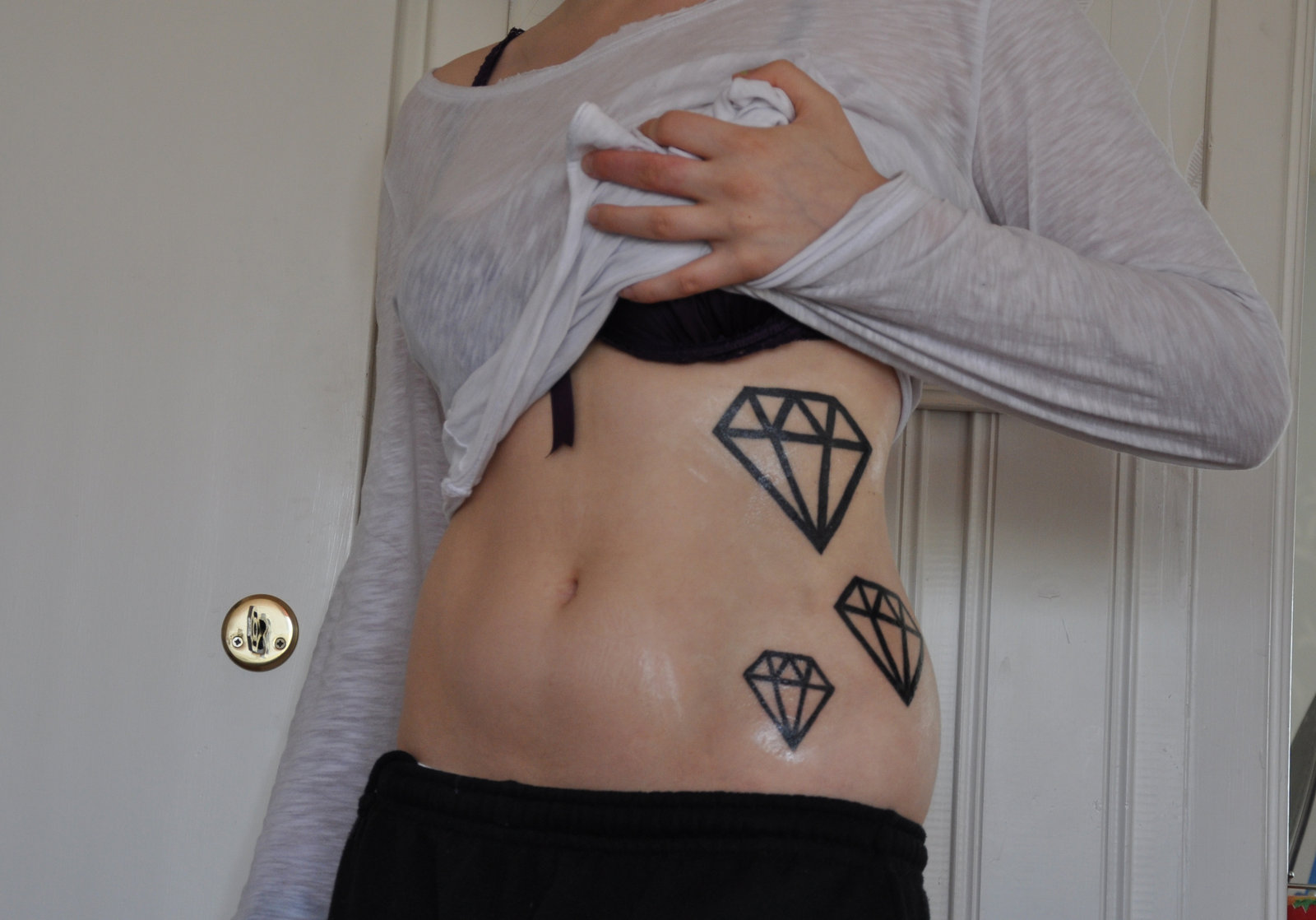 Black Outline Three Diamond Tattoo On Girl Side Rib