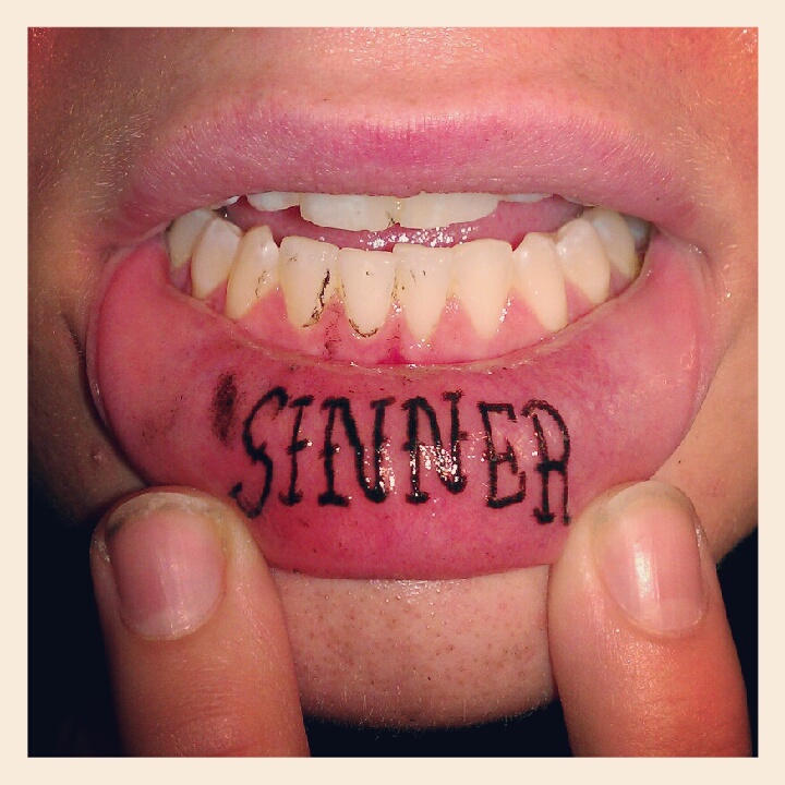 Black Sinner Lettering Tattoo On Inner Lip By Collin Jordan