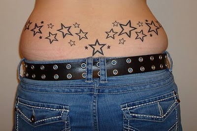 Black Star Tattoo On Man Lower Back
