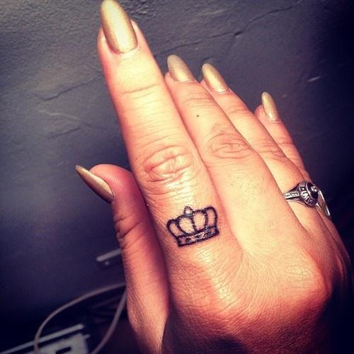 Black Tiny Crown Tattoo On Girl Finger
