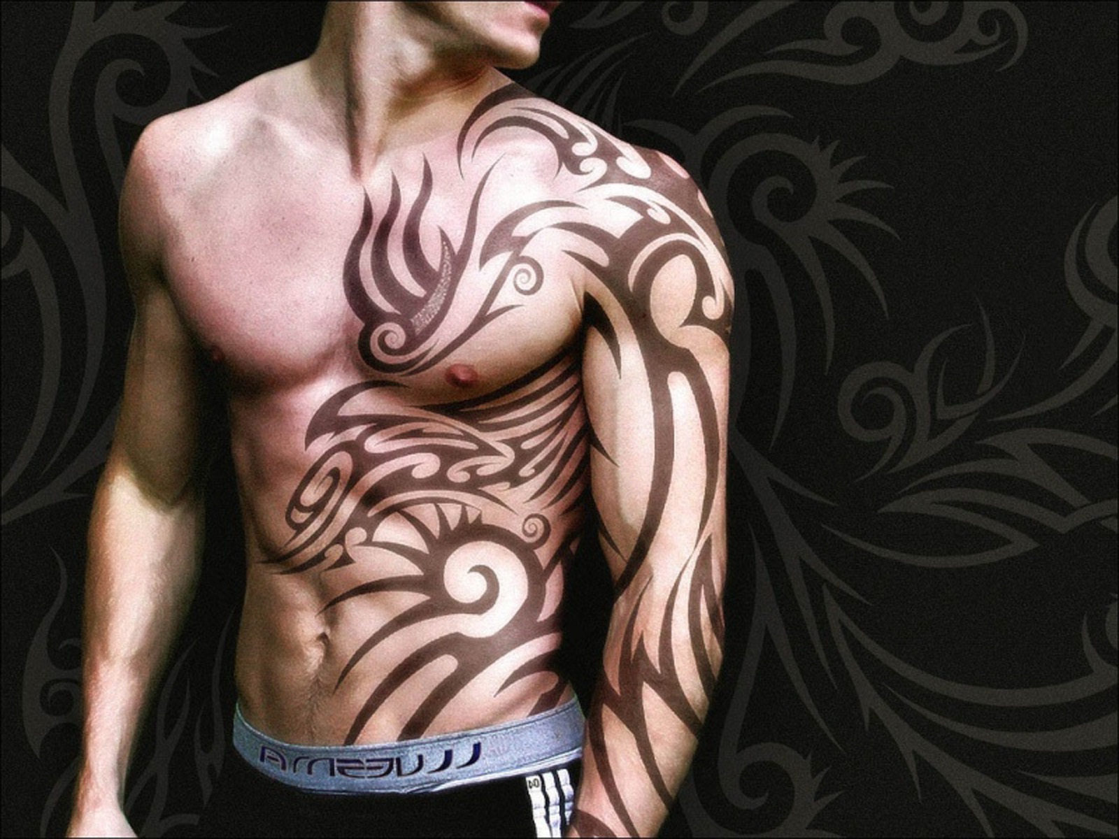 Black Tribal Design Tattoo On Man Full Body