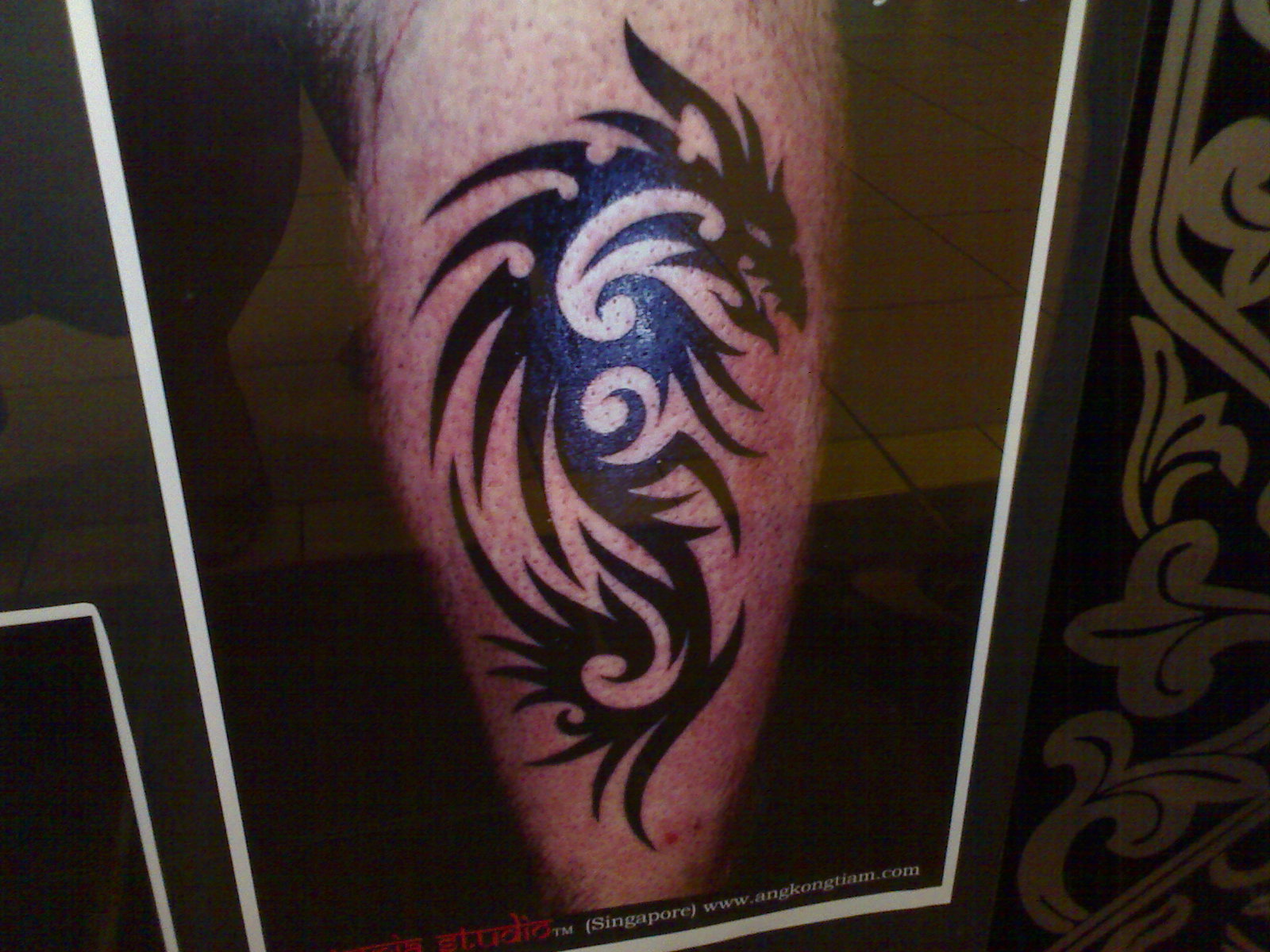 Black Tribal Dragon Tattoo On Leg Calf