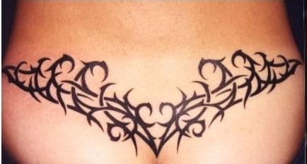 Black Tribal Swirl Tattoo On Lower Back