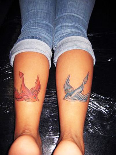 Blue And Red Two Flying Bird Tattoo On Both Leg Calf