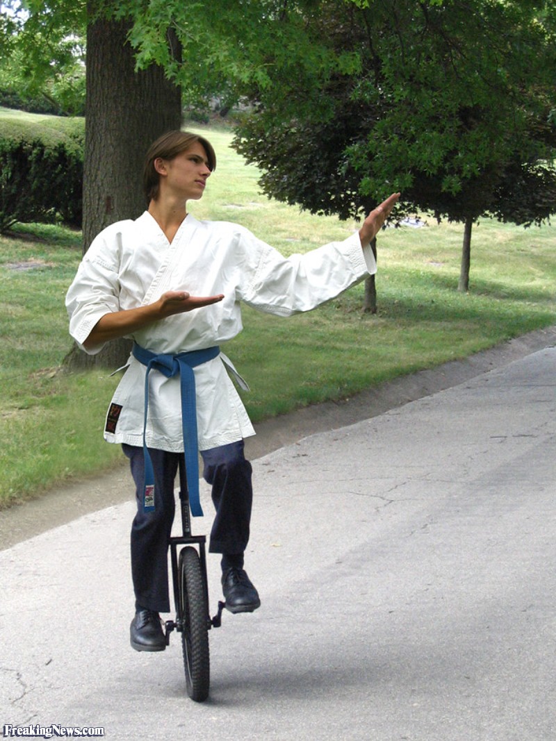 Boy In Karate Costume On Unicycle Funny Picture