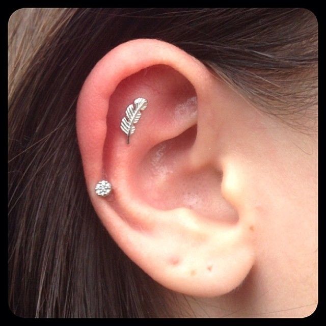 Cartilage Feather Stud Piercing On Girl Right Ear