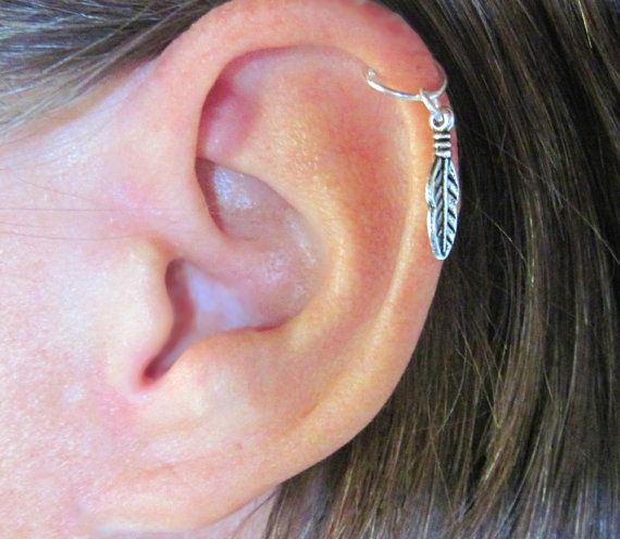 Cartilage Piercing With Small Silver Feather
