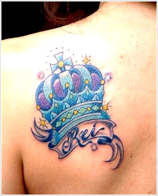 Colorful Crown With Banner Tattoo On Left Back Shoulder