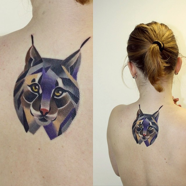 Colorful Geometric Lynx Head Tattoo On Girl Upper Back