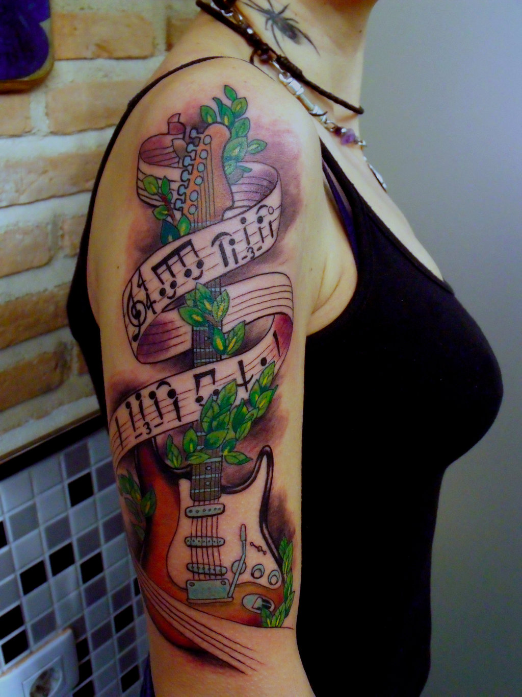 Colorful Guitar With Banner Tattoo On Girl Right Half Sleeve