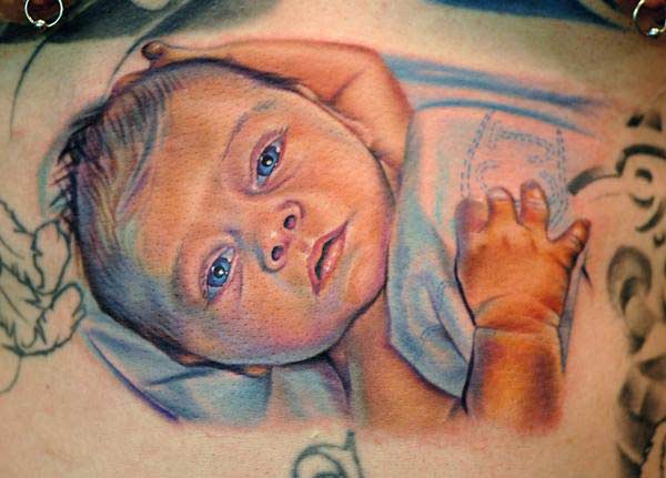 Colorful Laying Baby Tattoo Design