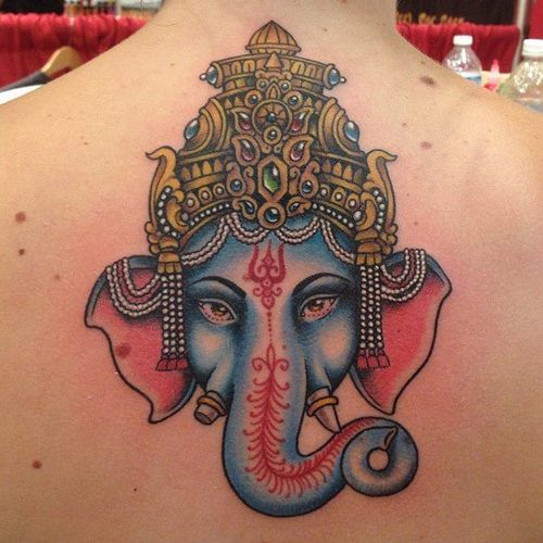 Colorful Lord Ganesha Head Tattoo On Upper Back