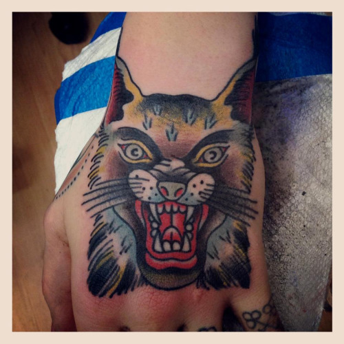 Colorful Lynx Head Tattoo On Hand