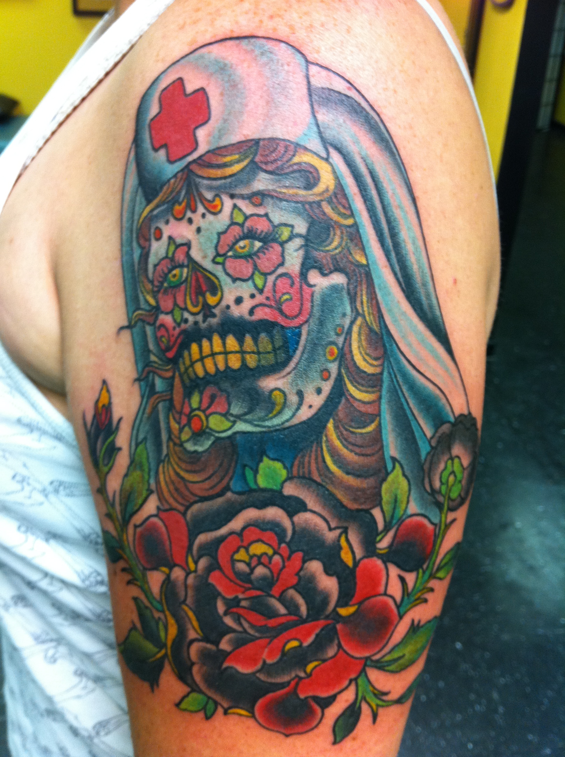 Colorful Nurse Skull With Rose Tattoo On Left Shoulder
