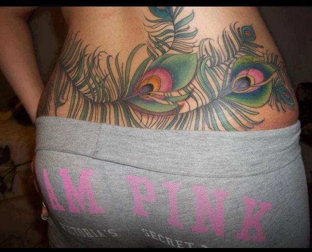 Colorful Two Peacock Feather Tattoo On Girl Lower Back