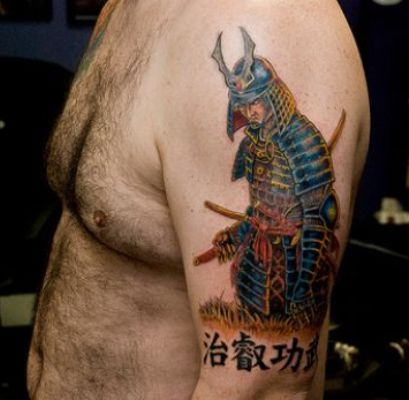 Colorful Warrior Tattoo On Man Left Shoulder