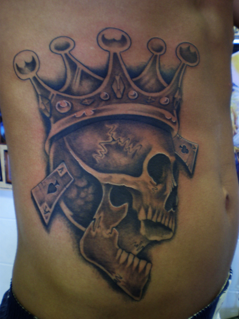 Crown On Skull Head Tattoo On Man Side Rib