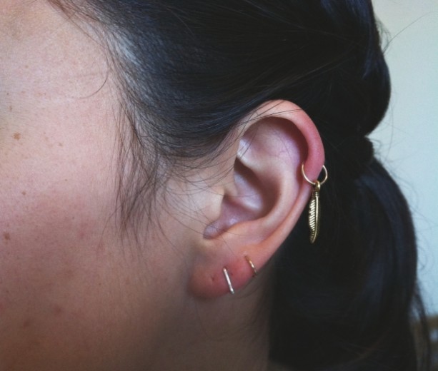 Dual Ear Lobe And Feather Ear Ring Helix Piercing