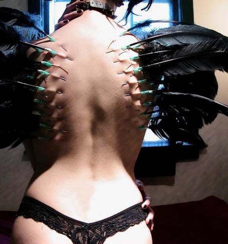 Extreme Feathers Piercing On Girl Back Body
