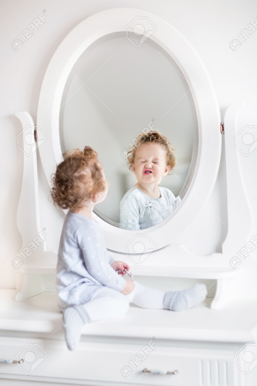 Funny Baby Girl Close Eyes In Front Of Mirror