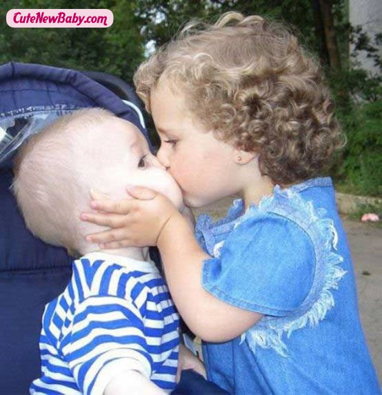 funny baby kissing photosimage
