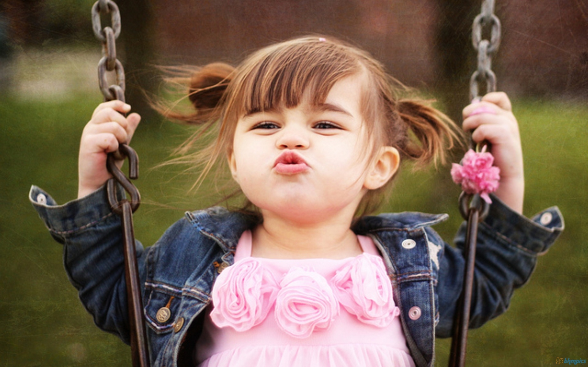 Funny Baby Girl On Swing With Pouting Face