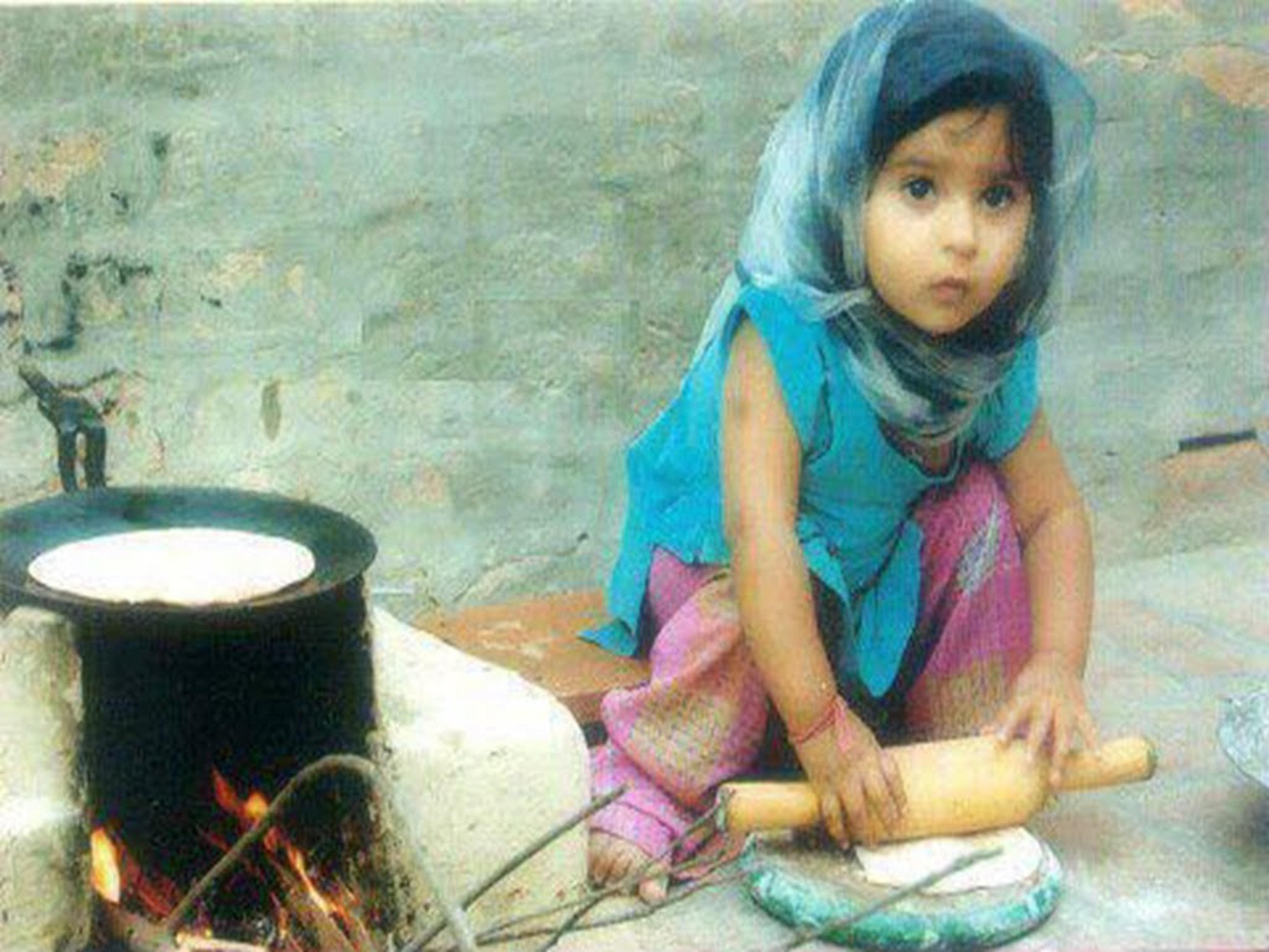 Funny Indian Baby Girl Making Food
