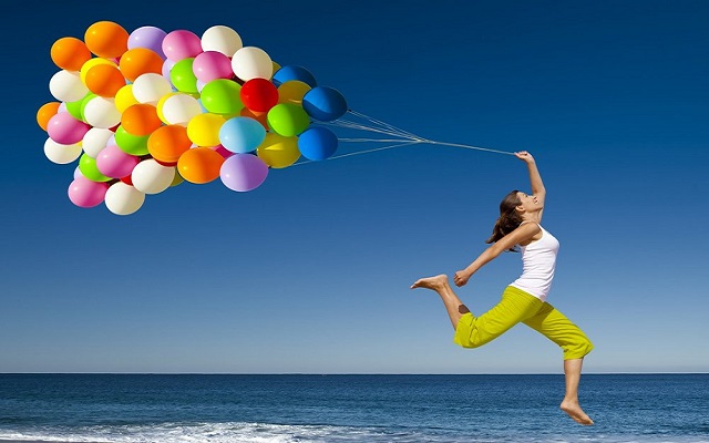 Girl With Colorful Balloons On Beach Enjoying Picture