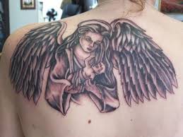 Grey And Black Baby On Angel Hand Tattoo On Left Back Shoulder