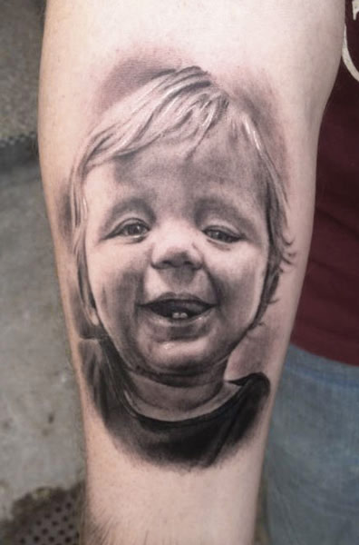 Grey Ink 3D Realistic Baby Face Tattoo Design