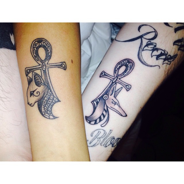 Grey Ink Ankh With Bastet Head Tattoo On Couple Forearm