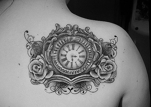 Grey Ink Clock With Two Roses Tattoo On Right Back Shoulder