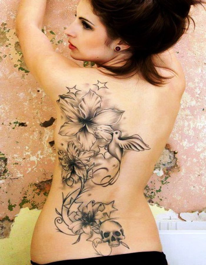 Grey Ink Flying Bird With Flowers And Skull Tattoo On Women Full Back