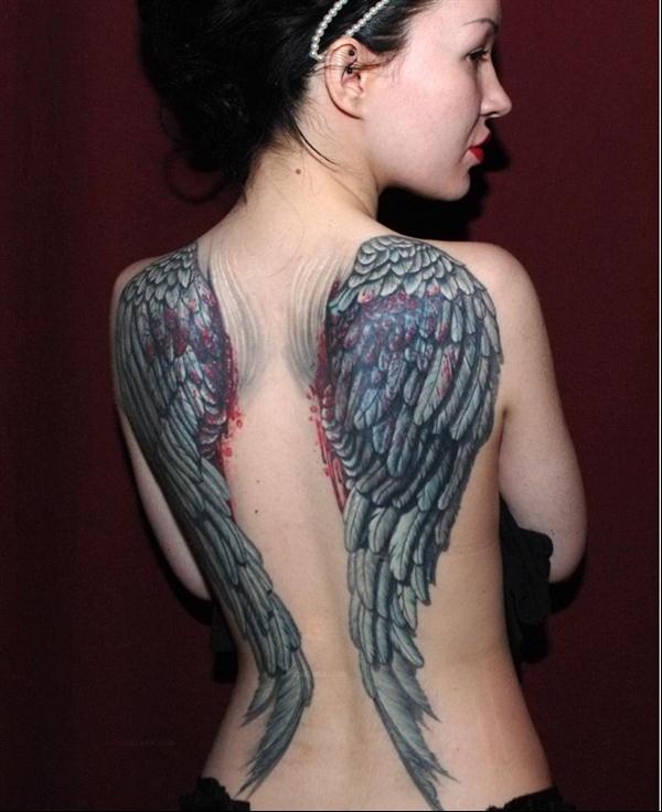Grey Ink Wings Tattoo On Women Full Back