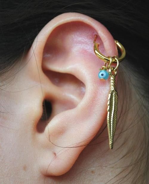 Helix Piercing On Left Ear With Beautiful Gold Feather Ring