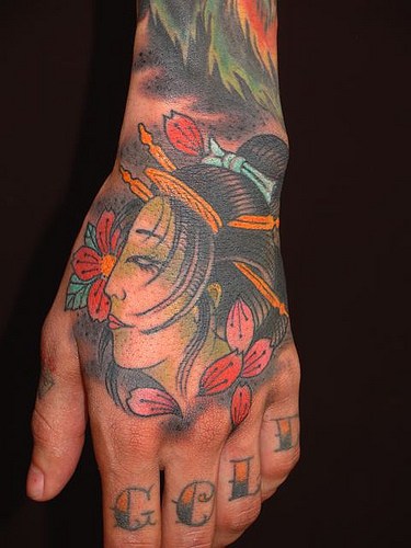 Japanese Girl Face Tattoo On Hand