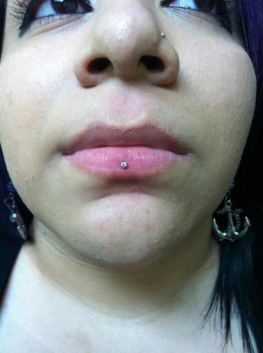 Left Nostril And Lower Lip Ashley Piercing Image.