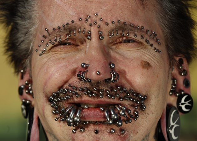 Old Man With Extreme Face Piercings