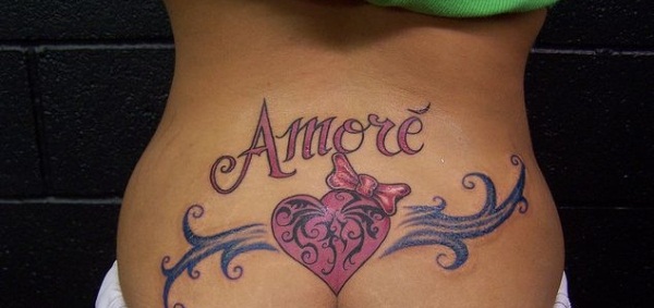 Pink Heart With Bow Tattoo On Girl Lower Back