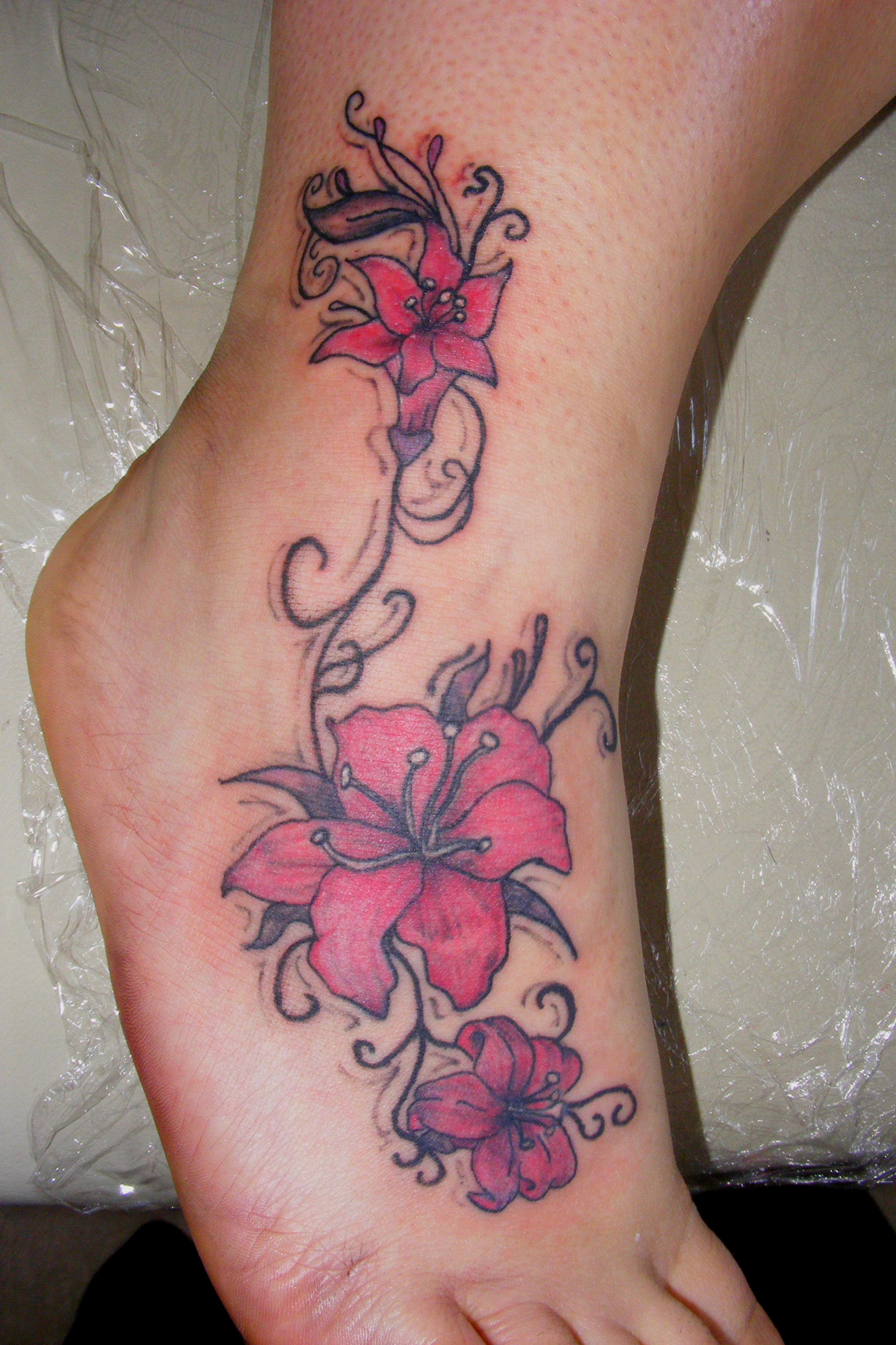 Pink Lily Flowers Tattoo On Foot