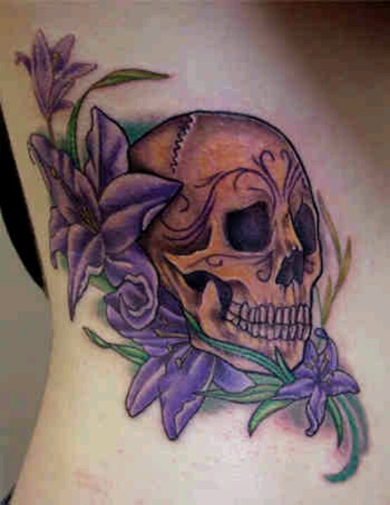 Purple Lily Flowers With Skull Tattoo Design For Side Rib