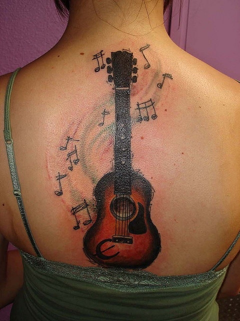 Red And Black Guitar Tattoo On Girl Upper Back By Nickhole