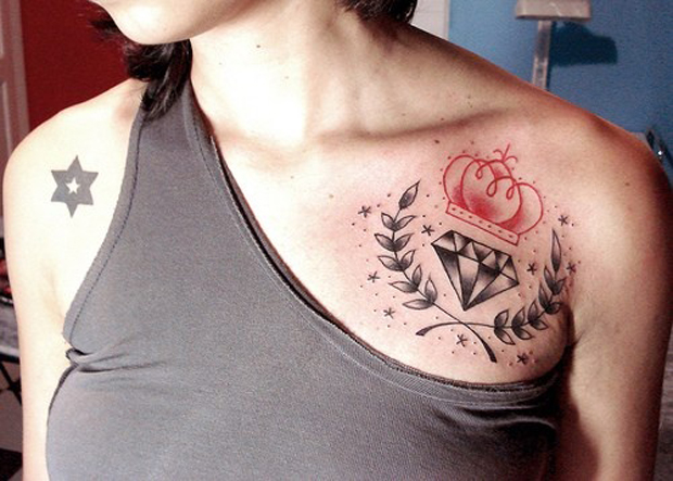 Red Crown With Black Diamond Tattoo On Girl Left Front Shoulder