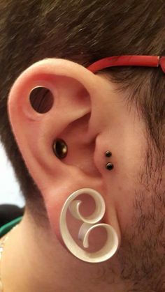 Right Ear Lobe And Stretched Cartilage Ear Piercing