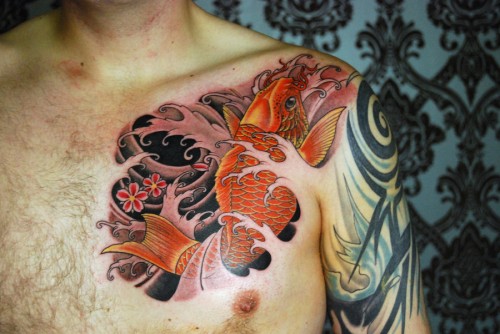 Ripped Skin Koi Fish Tattoo On Man Left Front Shoulder