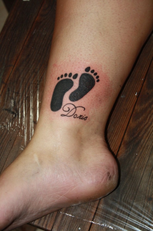 Silhouette Baby Feet Print Tattoo On Leg