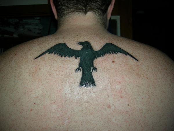 Silhouette Raven Tattoo On Man Upper Back